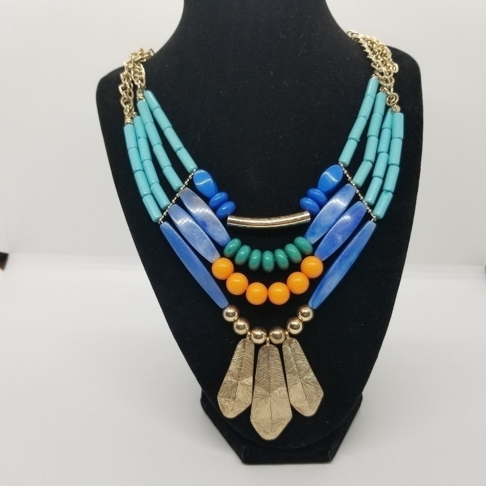layered multicolor bib necklace with feather-like pendants